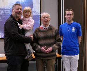 Gary Hogan (left, with daughter Natasha) and James Connors (right) receive joint third prize from John Fullwood