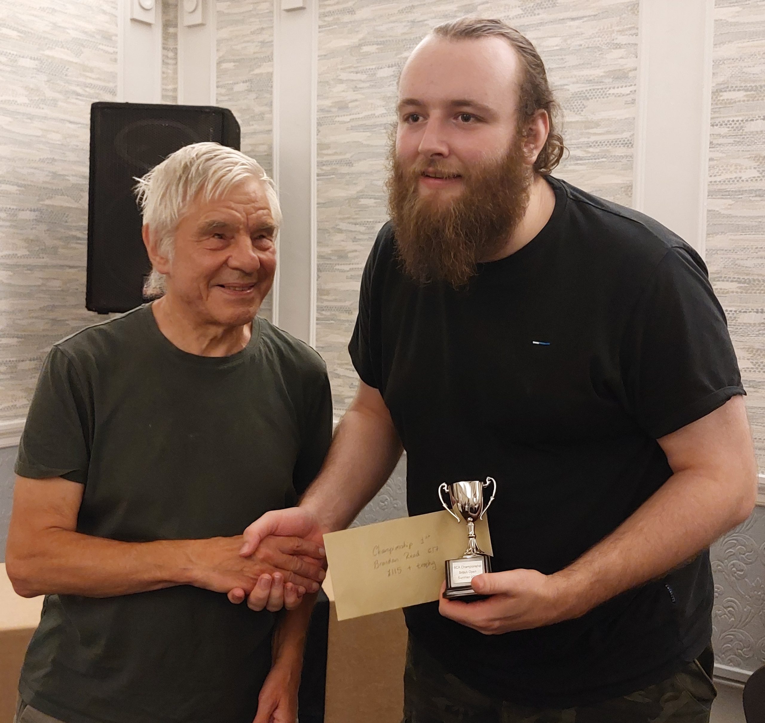 Brandan Read (R) receives BCA British Championship trophy from Chairman Voldi Gailans.