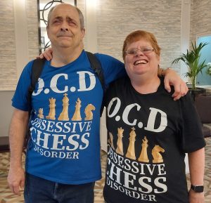Mark and Lea wearing their Obsessive Chess Disorder t-shirts